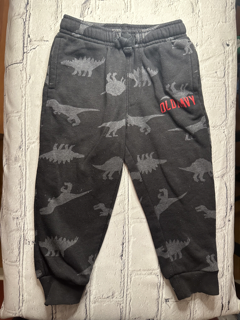 Old Navy, 18-24 Mo, sweatpants joggers, black w. grey dinosaur pattern, side pockets, red ‘Old Navy’ detail on left